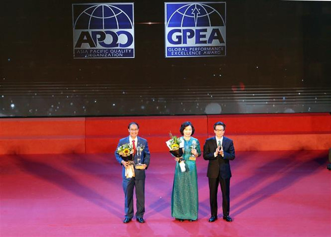 政府副总理武德儋出席2018年越南国家质量奖暨亚太国际质量奖颁奖仪式 ảnh 1 政府副总理武德儋出席2018年越南国家质量奖暨亚太国际质量奖颁奖仪式 ảnh 1