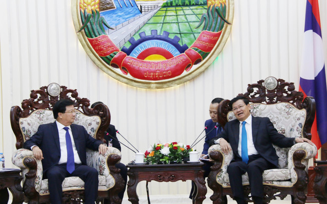 老挝领导人：越老关系向好发展 ảnh 1