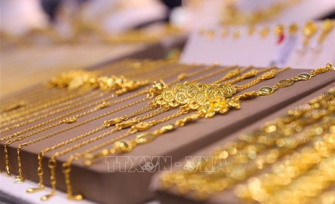 越南黄金市场：12月26日中午黄金价格每两突破8000万越南盾 ảnh 1