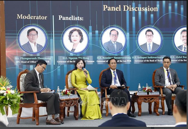 越南国家银行行长出席国际货币基金组织在老挝举办的研讨会 ảnh 1
