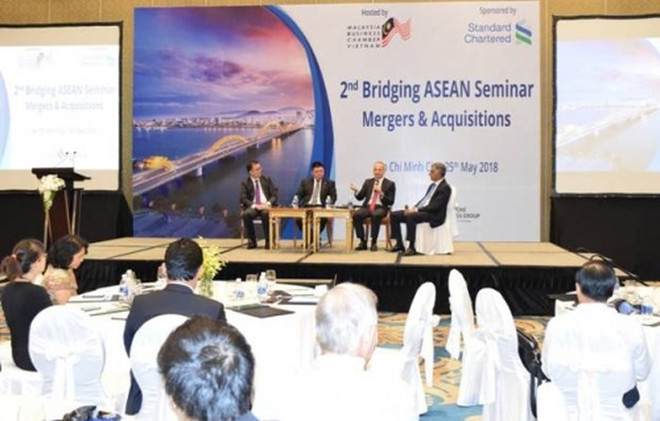 渣打银行承诺协助越南促进并购活动发展 ảnh 1