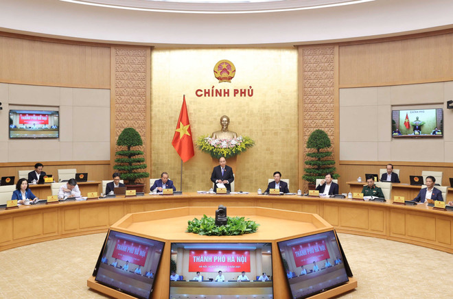 政府总理阮春福：尽早颁布“疫苗护照”机制 促进贸易和投资发展 ảnh 1