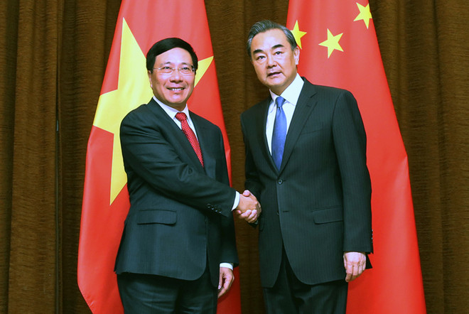 越南政府副总理兼外交部长范平明同中国外交部长王毅举行会谈 ảnh 1 越南政府副总理兼外交部长范平明同中国外交部长王毅举行会谈 ảnh 1