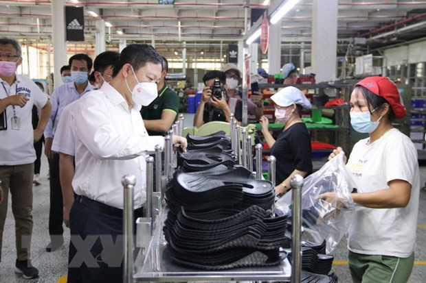 胡志明市宝元(越南)股份有限公司逾3.8万名工人重返工作岗位 ảnh 2 胡志明市宝元(越南)股份有限公司逾3.8万名工人重返工作岗位 ảnh 2