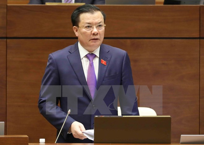 第十四届国会第四次会议：财政部长丁进勇接受国会代表质询 ảnh 1