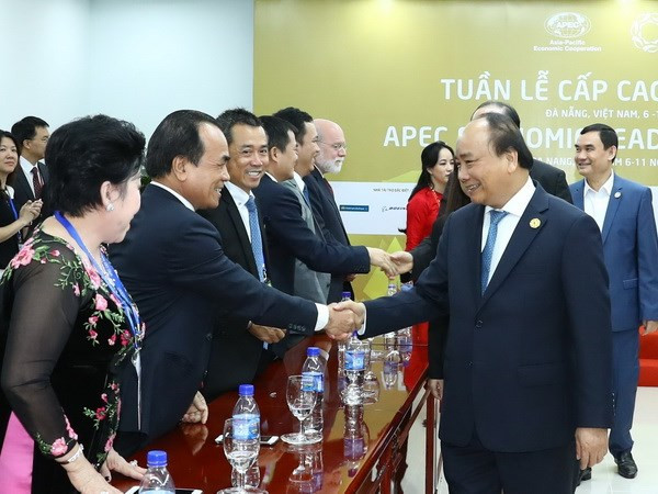 政府总理阮春福会见出席2017年APEC工商领导人峰会的大型企业领导 ảnh 3 政府总理阮春福会见出席2017年APEC工商领导人峰会的大型企业领导 ảnh 3