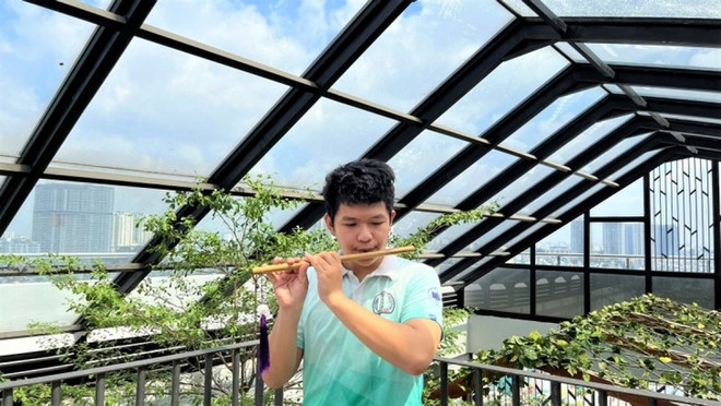 保护民族传统音乐的年轻 ảnh 1