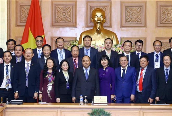 政府总理阮春福会见获得2018年国家知名品牌的企业代表 ảnh 1 政府总理阮春福会见获得2018年国家知名品牌的企业代表 ảnh 1