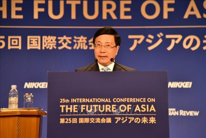 越南政府副总理范平明：世界正在进入一个充满不确定性的新时代 ảnh 1