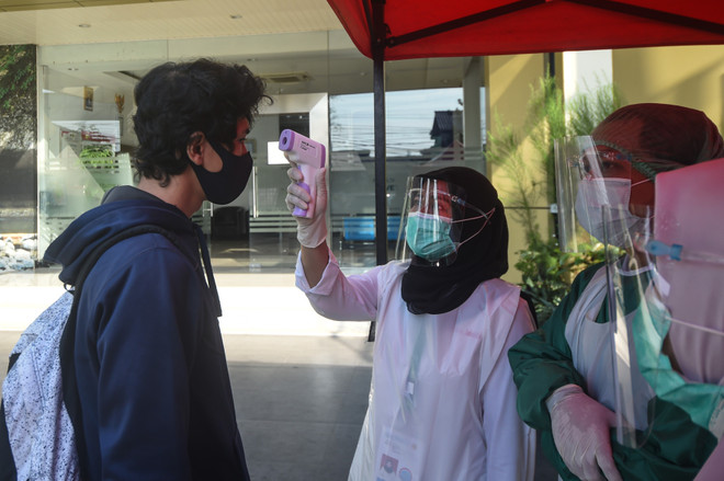 新冠肺炎疫情：菲律宾和印度尼西亚新增确诊病例超千例 ảnh 1