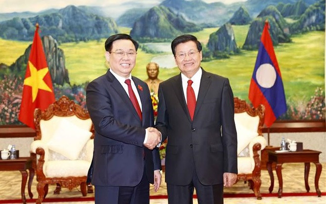 越南国会主席王廷惠礼节性拜会老挝人民革命党中央总书记、国家主席 ảnh 1 越南国会主席王廷惠礼节性拜会老挝人民革命党中央总书记、国家主席 ảnh 1