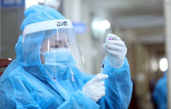 新冠疫苗接种一年回望：“盾牌”战役取得成功 ảnh 1