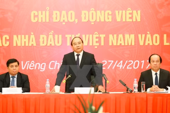阮春福总理:老挝越南企业在投资经营活动中需保持言行一致 ảnh 1 阮春福总理:老挝越南企业在投资经营活动中需保持言行一致 ảnh 1