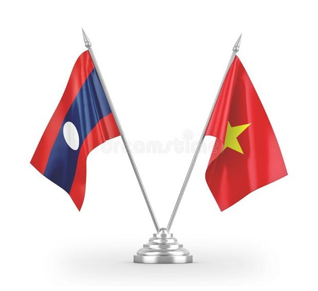 越南外交部代表团赴老挝驻越南大使馆庆祝国庆46周年 ảnh 1 越南外交部代表团赴老挝驻越南大使馆庆祝国庆46周年 ảnh 1