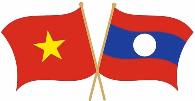 越南党和国家领导人向老挝致国庆贺电 ảnh 1