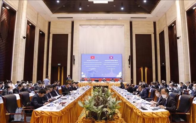越南共产党与老挝人民革命党第九次理论研讨会在万象举行 ảnh 1