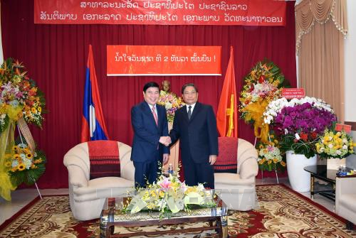 越老建交55周年：胡志明市领导祝贺老挝建国42周年 ảnh 1