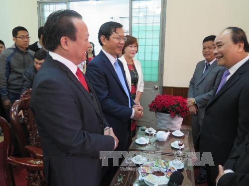 越南政府副总理阮春福向岘港市拜年 ảnh 1 越南政府副总理阮春福向岘港市拜年 ảnh 1