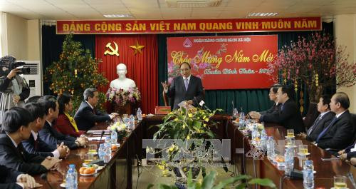 越南党和国家领导向各机构和地方拜年 ảnh 2 越南党和国家领导向各机构和地方拜年 ảnh 2