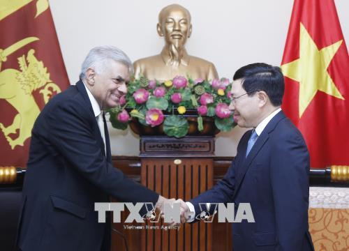 越南政府副总理兼外交部长范平明会见斯里兰卡总理拉尼尔•维克勒马辛哈 ảnh 1 越南政府副总理兼外交部长范平明会见斯里兰卡总理拉尼尔•维克勒马辛哈 ảnh 1