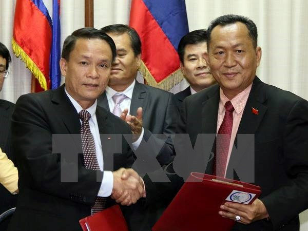 越南通讯社同老挝通讯社加强合作 携手前进 ảnh 1 越南通讯社同老挝通讯社加强合作 携手前进 ảnh 1