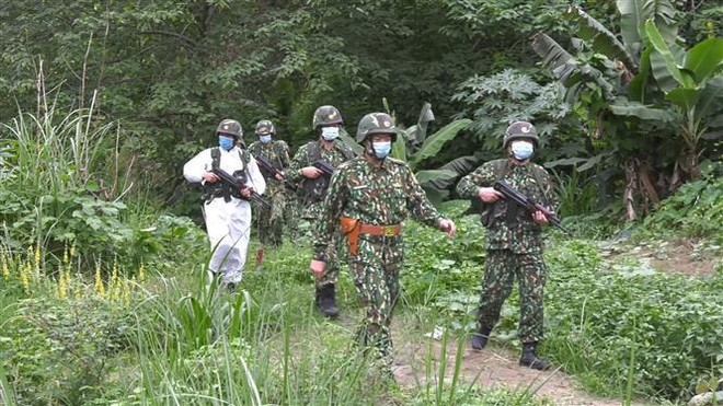 越南老街省边防部队与中国云南省边防部队加强边境执法合作 ảnh 1