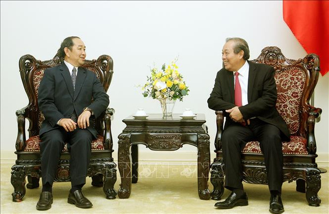 政府常务副总理张和平会见老挝最高人民法院院长坎帕•森达拉 ảnh 2