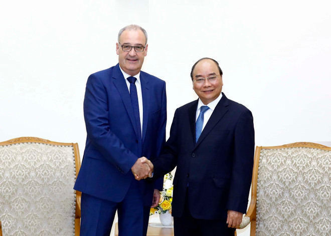 政府总理阮春福会见瑞士经济、教育及科研部长 ảnh 1