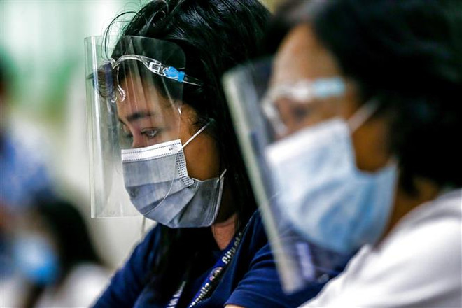 东南亚各国继续开展新冠肺炎疫情防控措施 ảnh 1