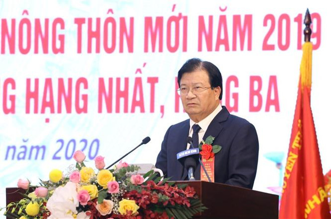 政府副总理郑廷勇出席李仁县达到新农村建设标准公布仪式 ảnh 1 政府副总理郑廷勇出席李仁县达到新农村建设标准公布仪式 ảnh 1