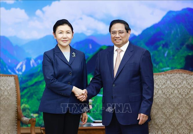 越南政府总理范明政会见中国司法部长贺荣 ảnh 1 越南政府总理范明政会见中国司法部长贺荣 ảnh 1