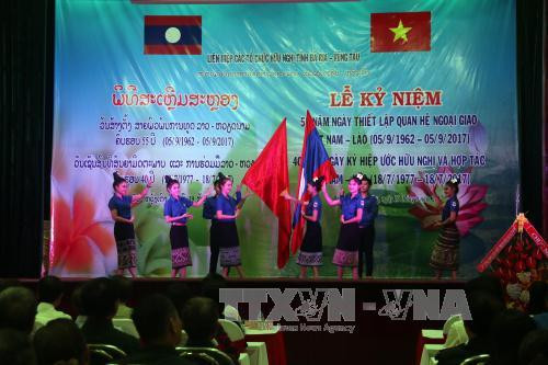 越老建交55周年：加强越老全面友好合作关系 ảnh 1