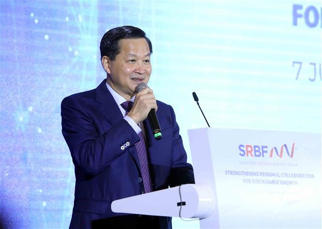 政府副总理黎明慨:越新两国企业发挥创造力,敢于突破,拥有更远大抱负以走得更远 ảnh 1 政府副总理黎明慨:越新两国企业发挥创造力,敢于突破,拥有更远大抱负以走得更远 ảnh 1