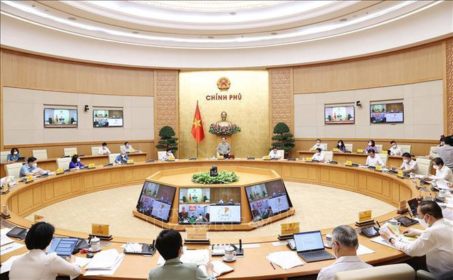 越南政府总理范明政:研究安全、灵活适应和有效控制疫情措施 ảnh 1 越南政府总理范明政:研究安全、灵活适应和有效控制疫情措施 ảnh 1