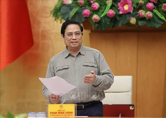 越南政府总理范明政:研究安全、灵活适应和有效控制疫情措施 ảnh 2 越南政府总理范明政:研究安全、灵活适应和有效控制疫情措施 ảnh 2