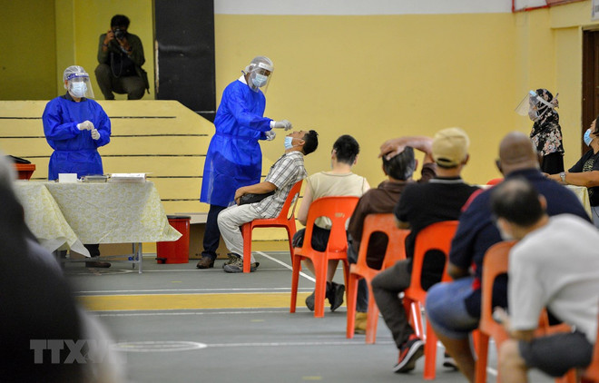 新冠肺炎疫情：马来西亚和菲律宾单日新增病例数千例 ảnh 1