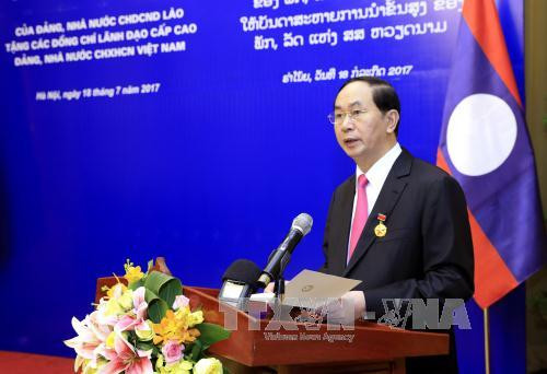 越南国家主席陈大光:愿为维护和继续培育越老特殊团结关系作出努力 ảnh 3  越南国家主席陈大光:愿为维护和继续培育越老特殊团结关系作出努力 ảnh 3