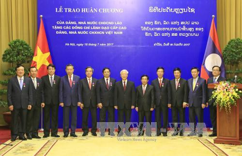 越南国家主席陈大光:愿为维护和继续培育越老特殊团结关系作出努力 ảnh 1  越南国家主席陈大光:愿为维护和继续培育越老特殊团结关系作出努力 ảnh 1