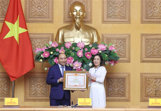 越南政府总理阮春福出席“为社会默默奉献的先进人物” 表彰大会 ảnh 2  越南政府总理阮春福出席“为社会默默奉献的先进人物” 表彰大会 ảnh 2