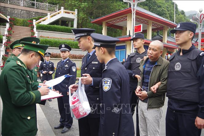 越中两国警方配合逮捕通缉犯 ảnh 1