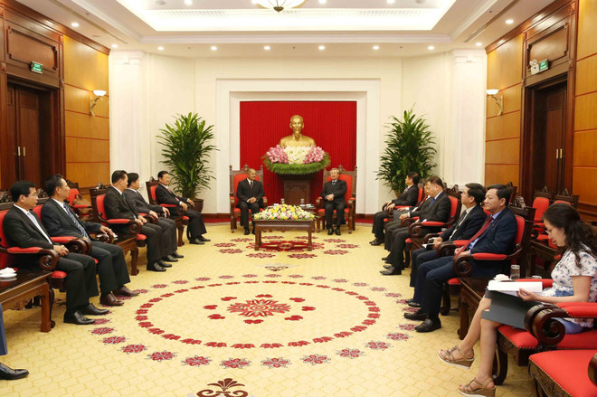 越共书记处常务书记陈国旺会见老挝人民革命党代表团 ảnh 2 越共书记处常务书记陈国旺会见老挝人民革命党代表团 ảnh 2