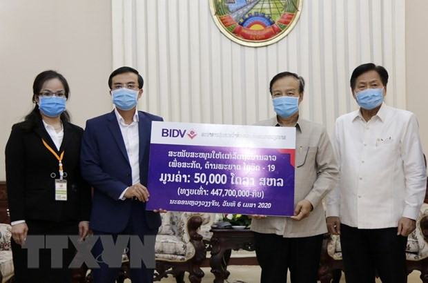 越南企业协助老挝应对新冠肺炎疫情 ảnh 2 越南企业协助老挝应对新冠肺炎疫情 ảnh 2
