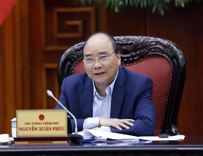 越南政府总理阮春福主持召开越共十三大经济社会常设小组会议 ảnh 2 越南政府总理阮春福主持召开越共十三大经济社会常设小组会议 ảnh 2