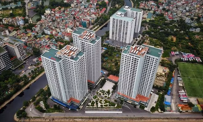 越南银行利率持续降温，房地产静待资金回流 ảnh 1