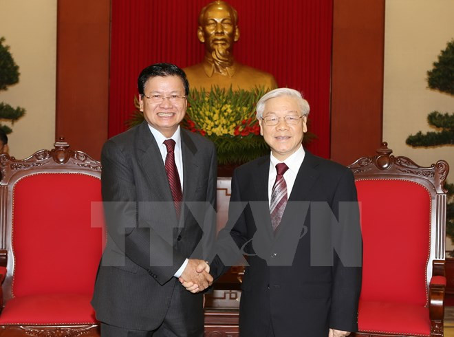 越共中央总书记阮富仲会见老挝外交部高级代表团 ảnh 1 越共中央总书记阮富仲会见老挝外交部高级代表团 ảnh 1