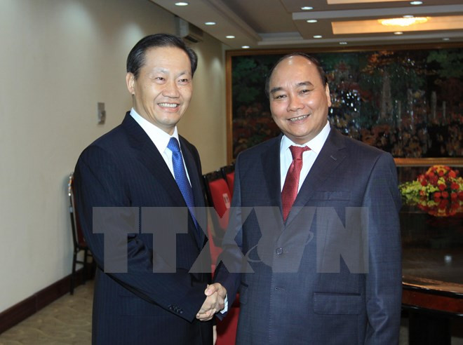 越南政府副总理阮春福会见中国广西壮族自治区党委书记彭清华 ảnh 1