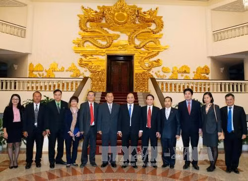 越南政府总理会见老挝巴特寮通讯社社长 ảnh 1