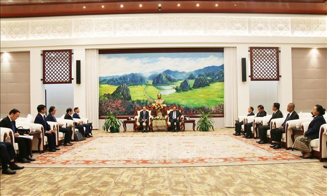 老挝人民革命党中央总书记、国家主席本扬·沃拉吉会见越共中央办公厅代表团 ảnh 1