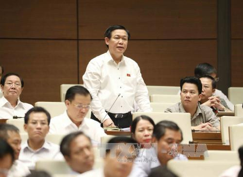 越南第十四届国会第三次会议:政府对公共投资资金到位进度缓慢负责任 ảnh 2 越南第十四届国会第三次会议:政府对公共投资资金到位进度缓慢负责任 ảnh 2