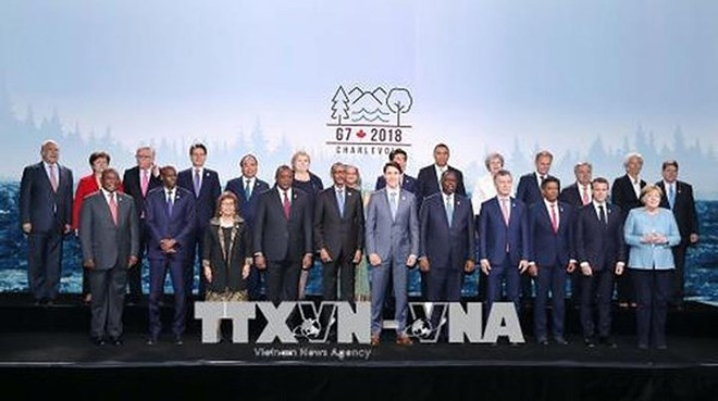 政府总理阮春福结束出席七国集团峰会扩大会议之旅 ảnh 2